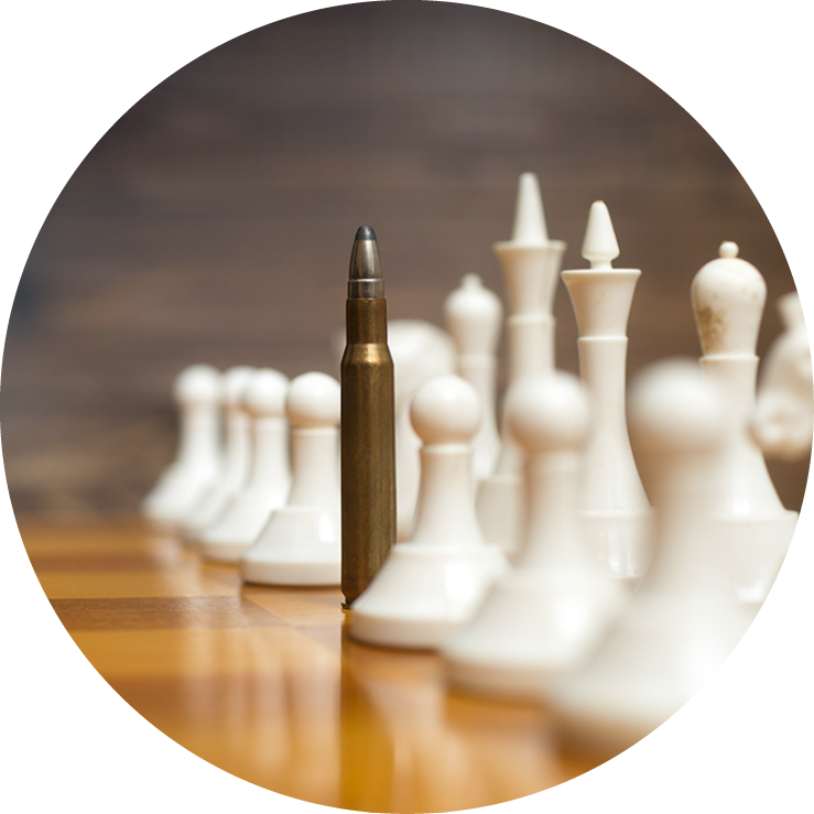 Closeup photo of bullet in row of white chess pieces on wooden board  Concept of military power