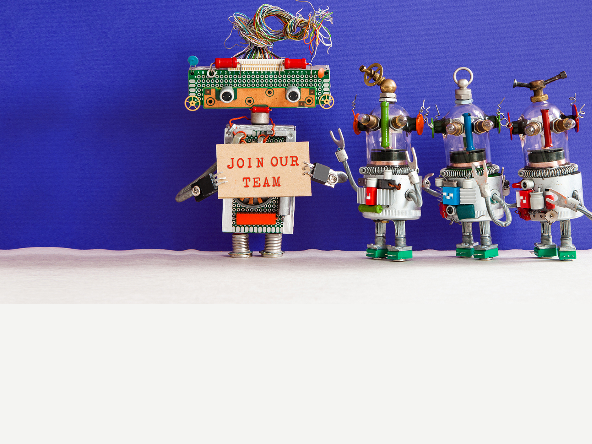 Join our team concept. Four funny robots looking for a new assistant in company team. Recruitment and headhinting banner