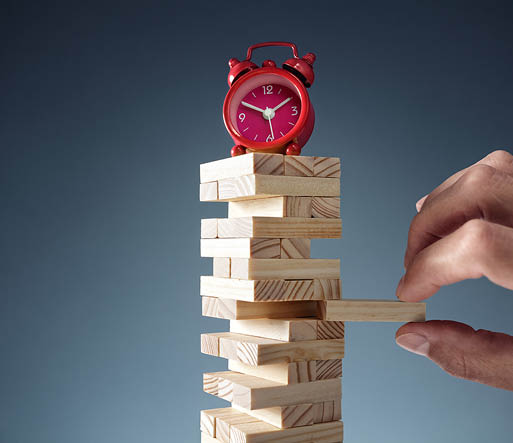 Planning, risk and strategy deadline time in business alarm clock on wooden blocks