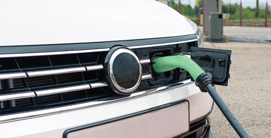 Socket plugged into electric car outdoors